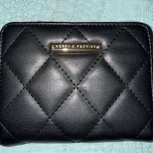 Poppy & Peonies Quilted Leather wallet.  Used once.  In perfect condition.